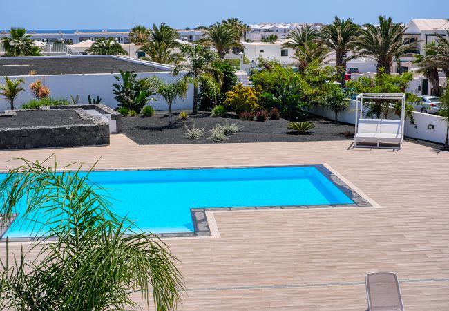 House in Costa Teguise - Sunset View: modern, pool side holiday home 